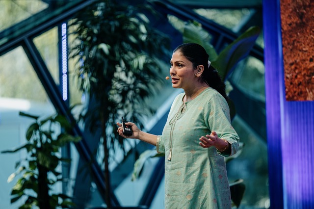 Sharbani Dhar presenting on stage during DO22: Reconnecting Design conference.
